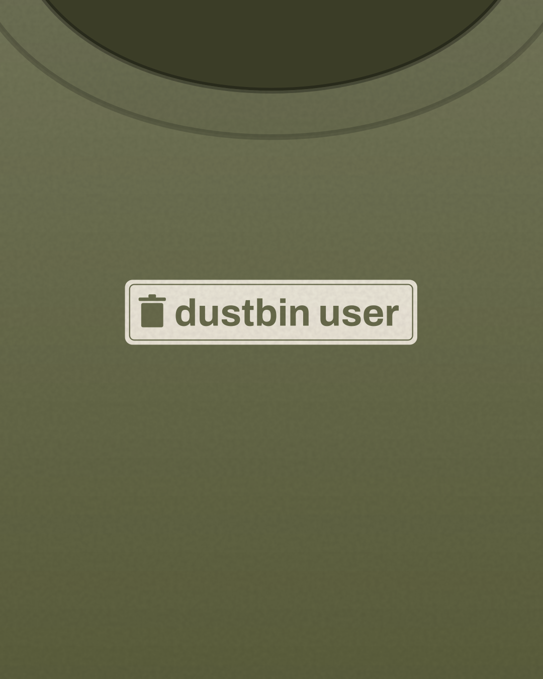 Close-up of the “dustbin user” print in cream on a olive tee