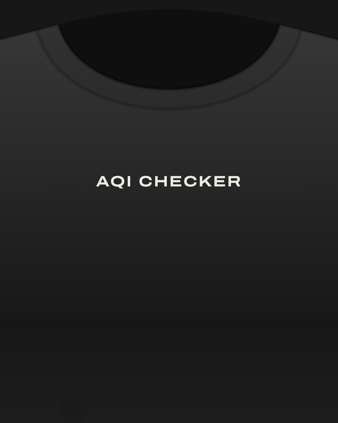 Close-up of a black tee with “AQI checker” printed small in off-white on the chest
