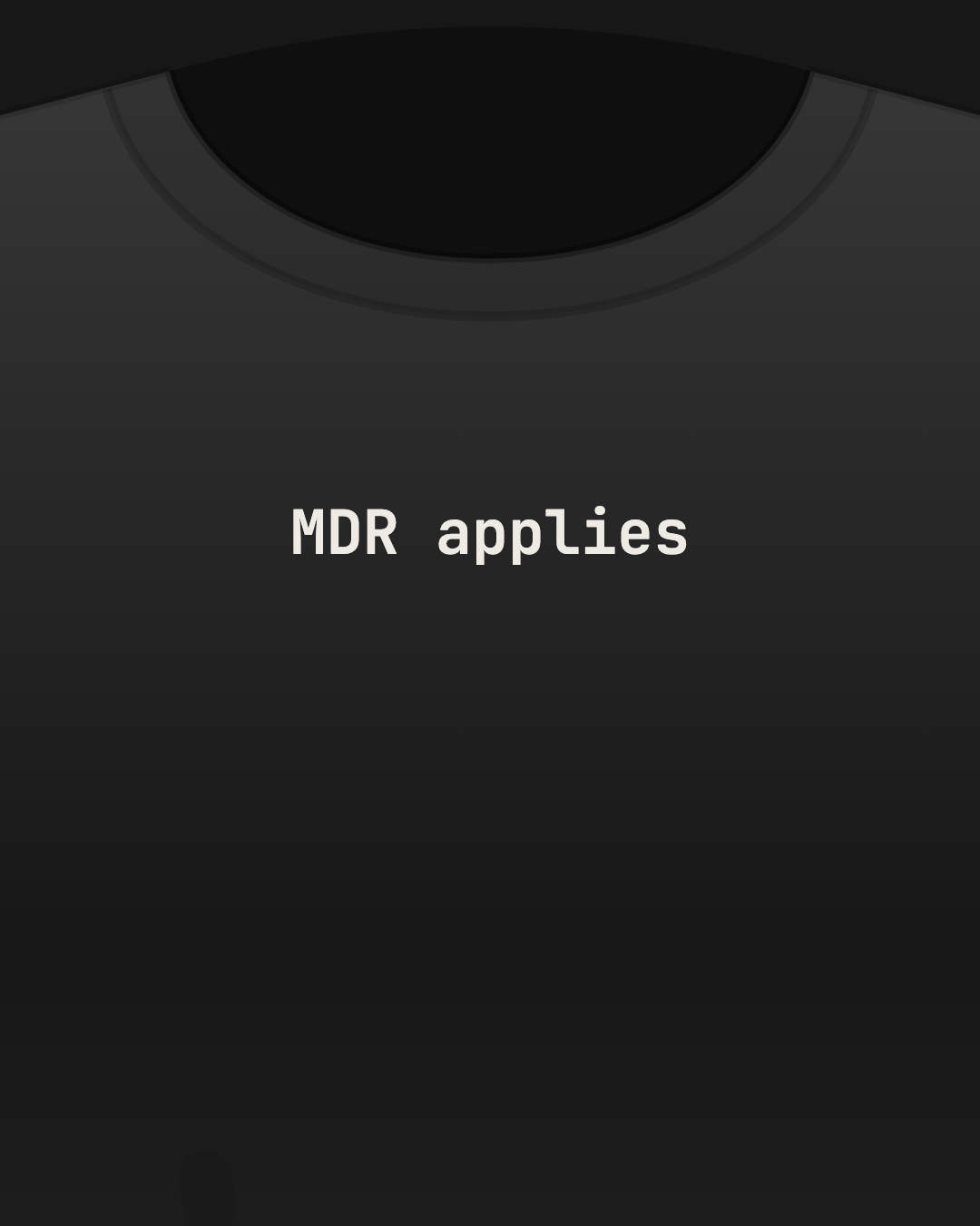 Close-up of a black tee with “MDR applies” printed small in off-white on the chest