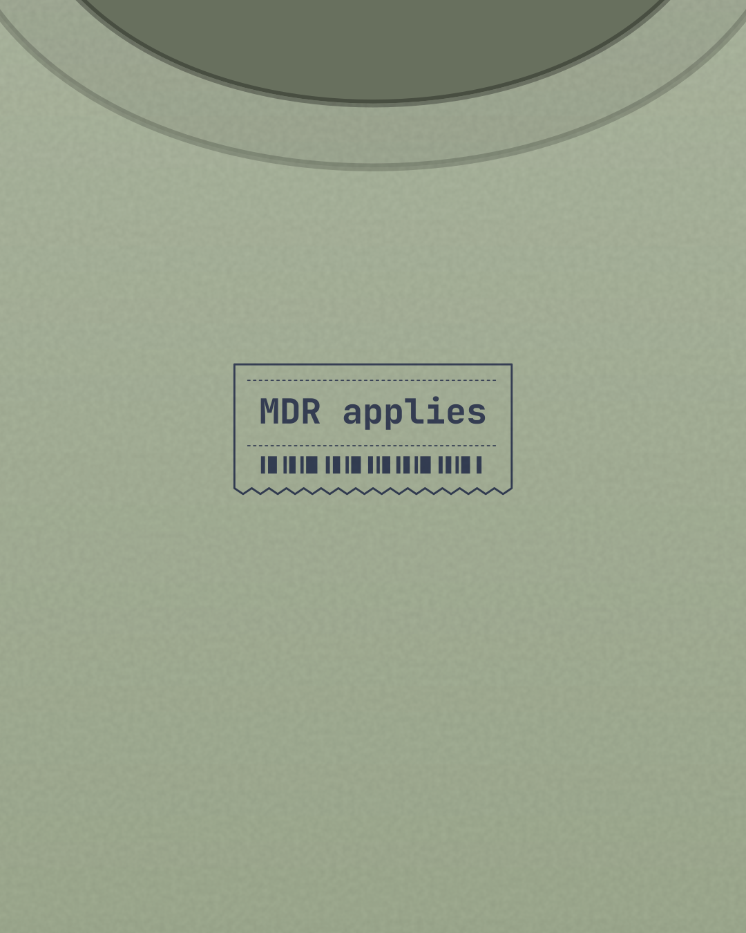 Close-up of the “MDR applies” print in navy on a sage tee