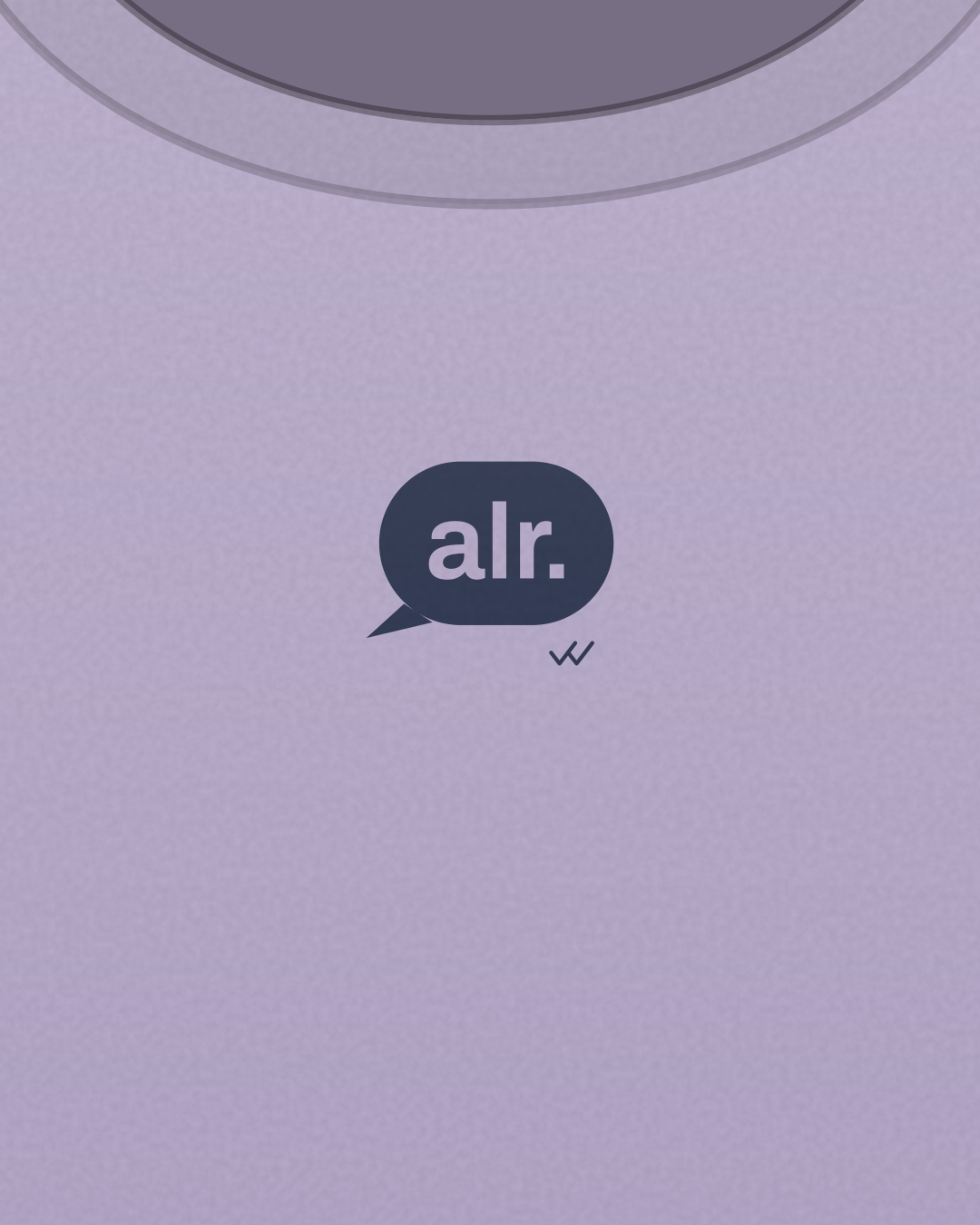 Close-up of the “alr.” print in navy on a lilac tee