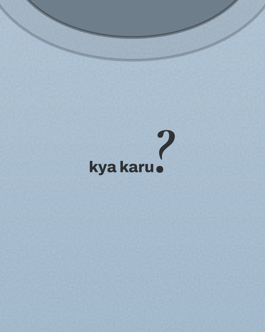 Close-up of the “kya karu?” print in black on a powder blue tee
