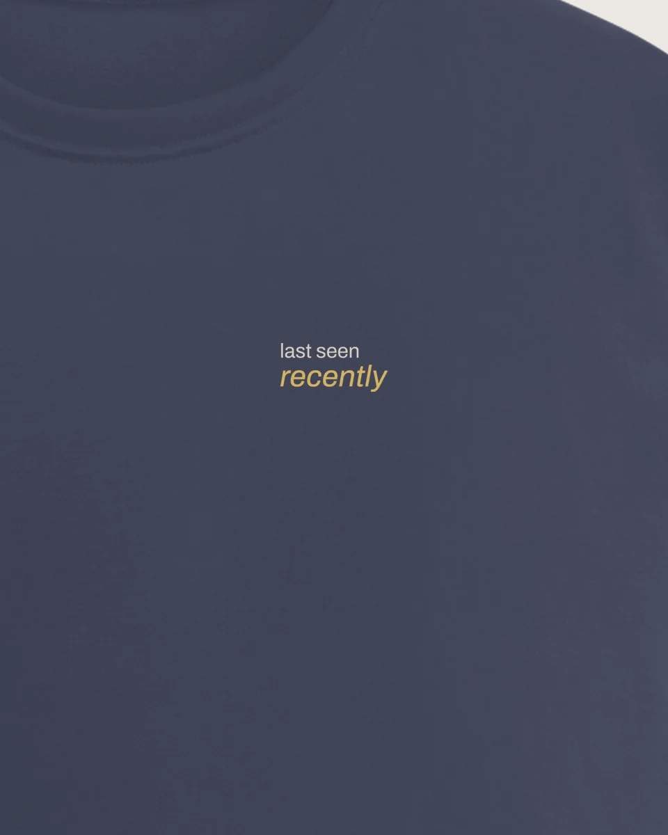 Mockup: close-up of “Last seen recently” printed on a navy regular tee